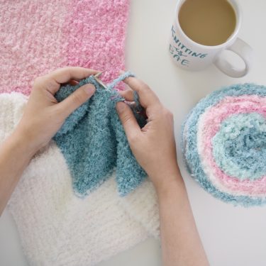 Click for a yarn review of Bernat Pipsqueak Stripes and the Cloud Nine Baby Blanket - a free pattern from Yarnspirations. #knittingpattern #yarnspirations #babyblanket