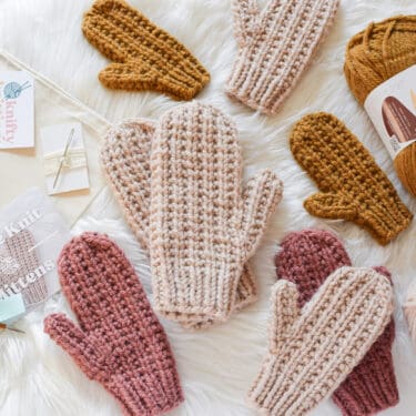 Cozy Waffle Knit Mittens in rich hues, showcasing a textured pattern and crafted with Hue and Me yarn. Ideal winter accessory for warmth and style, available in four sizes from child to adult. Perfect for chilly days and handmade comfort.